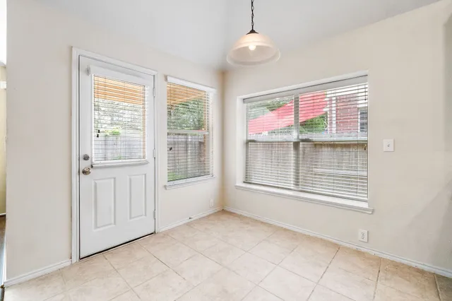 a kitchen with stainless steel appliances granite countertop a sink and a stove