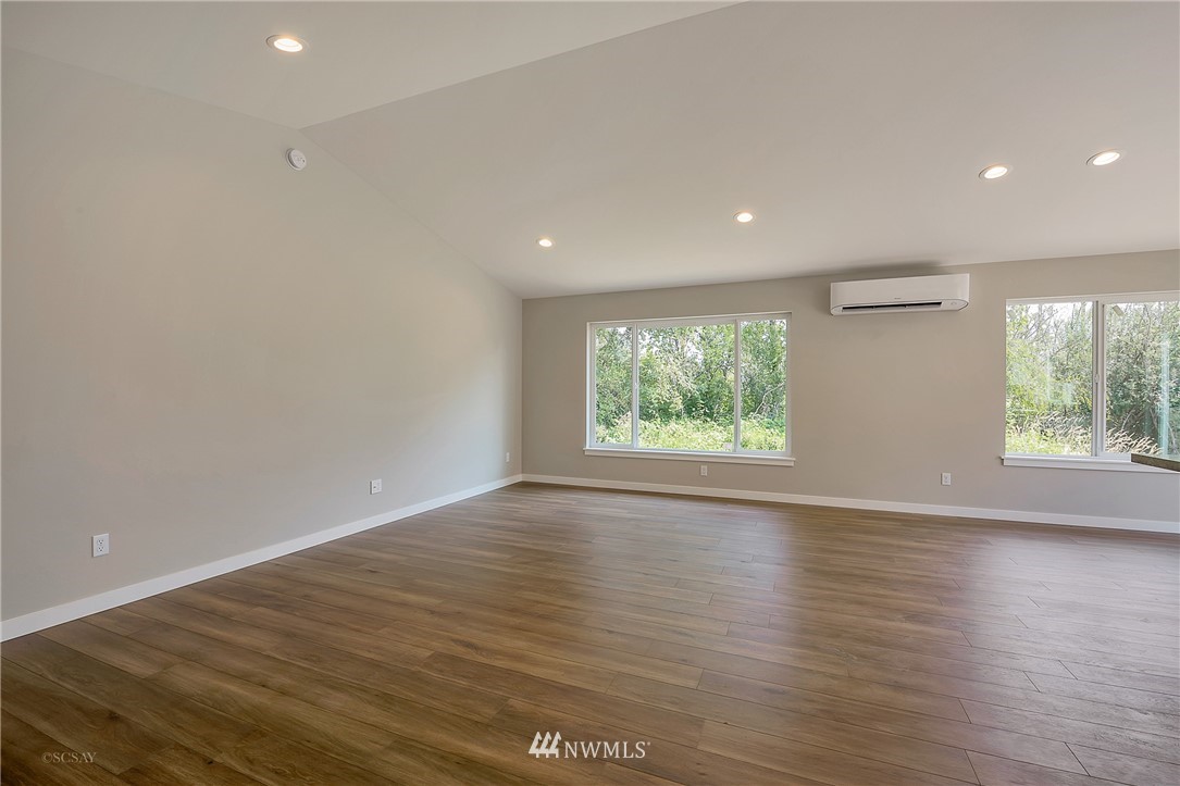 806 Nooksack Road Nooksack, WA 98276 - Photo 8 of 10 an empty room with wooden floor and windows