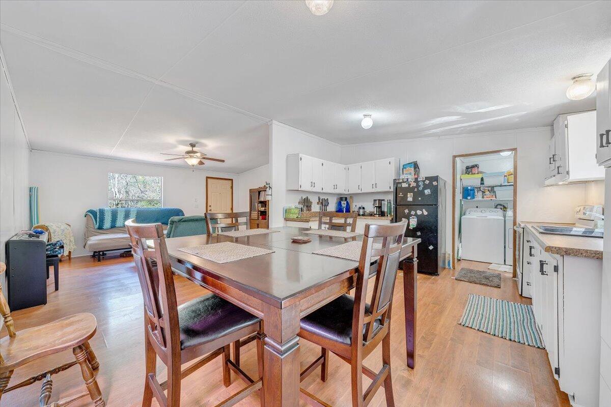 1660 Diamond Knob Road Northeast Check, VA 24072 - Photo 12 of 31 a view of a dining room with furniture and wooden floor