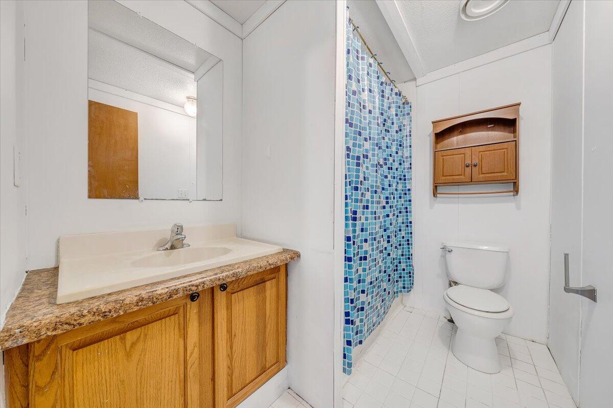 1660 Diamond Knob Road Northeast Check, VA 24072 - Photo 25 of 31 a bathroom with a sink a toilet and shower