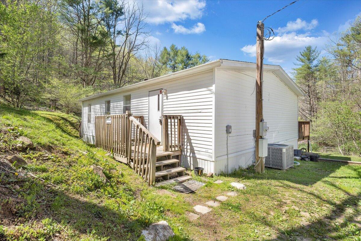 1660 Diamond Knob Road Northeast Check, VA 24072 - Photo 26 of 31 a view of a house with backyard and sitting area