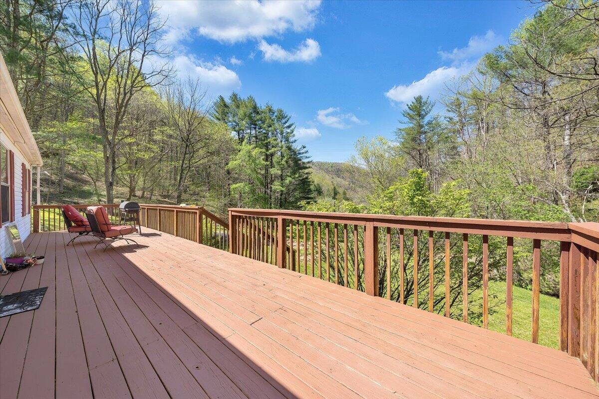 1660 Diamond Knob Road Northeast Check, VA 24072 - Photo 27 of 31 a view of roof deck with wooden floor and fence