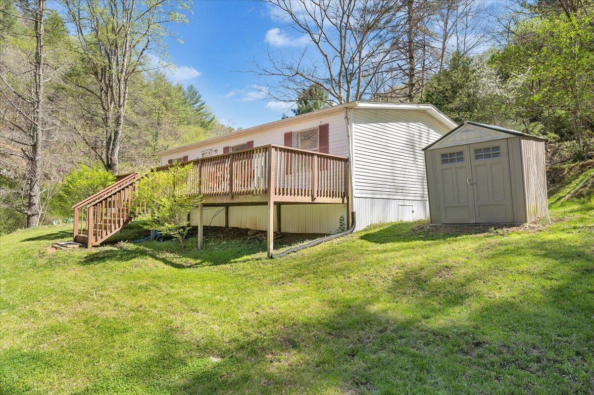 1660 Diamond Knob Road Northeast Check, VA 24072 - Photo 3 of 31 a view of backyard with wooden fence and a bench