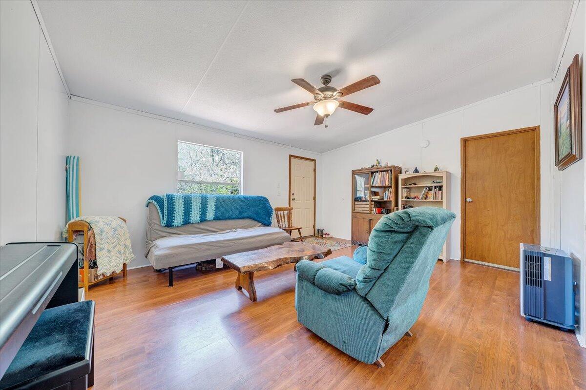 1660 Diamond Knob Road Northeast Check, VA 24072 - Photo 8 of 31 a living room with furniture and a wooden floor