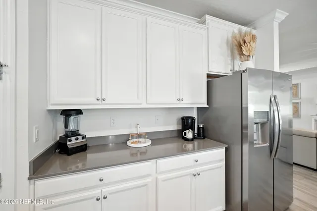 a view of living room with furniture and flat screen tv