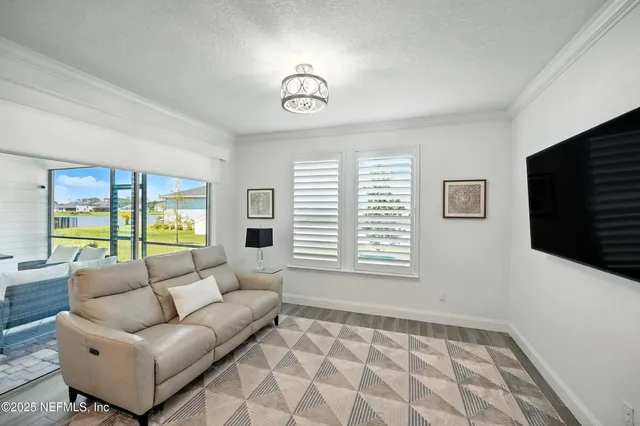 a bedroom with a bed couch and window