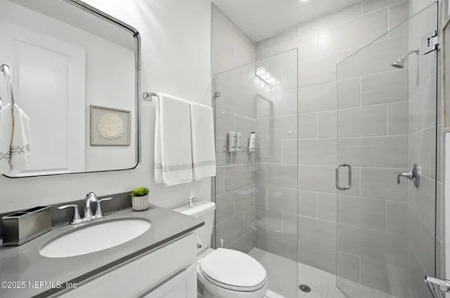 a view of a porch with furniture and garden