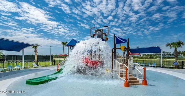 an aerial view of a house a garden and mountain view