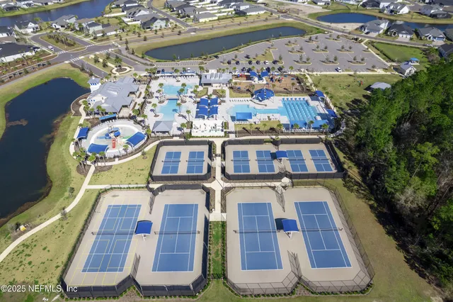 a aerial view of a house with a big yard