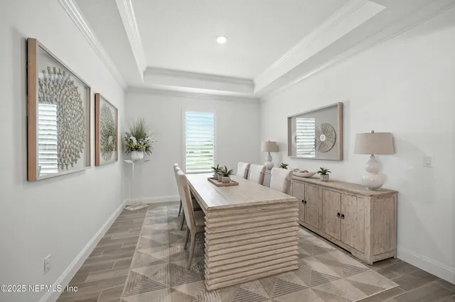 a kitchen with stainless steel appliances kitchen island granite countertop a stove a sink a dining table and chairs