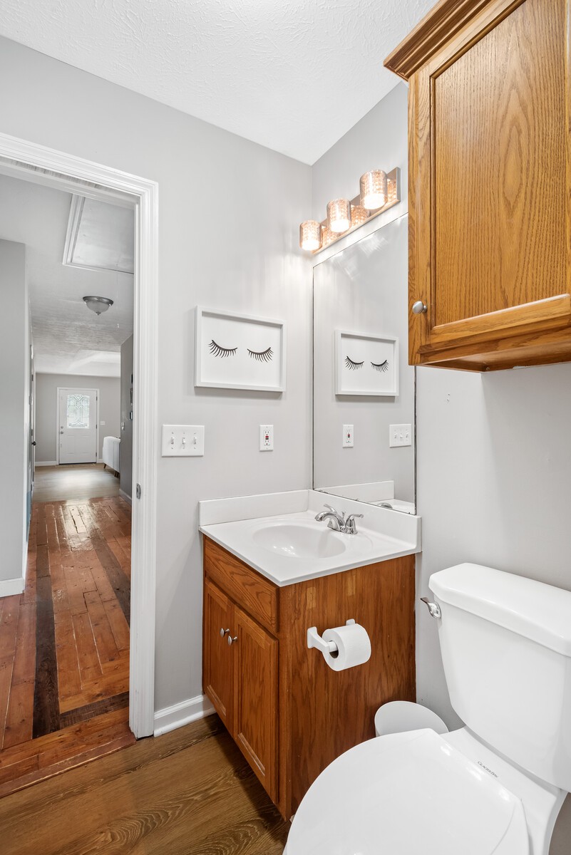 362 Norene Road Lebanon, TN 37090 - Photo 19 of 40 a bathroom with a granite countertop toilet a sink and a mirror