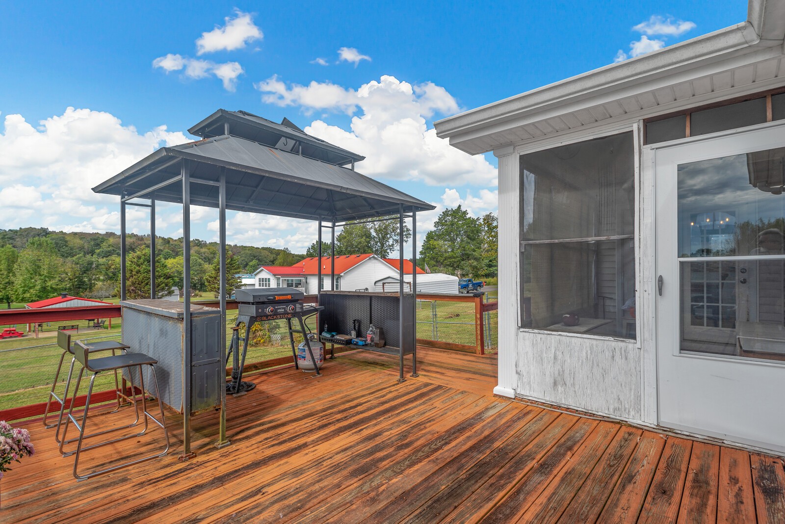 362 Norene Road Lebanon, TN 37090 - Photo 27 of 40 a view of a patio with table and chairs under an umbrella with wooden floor