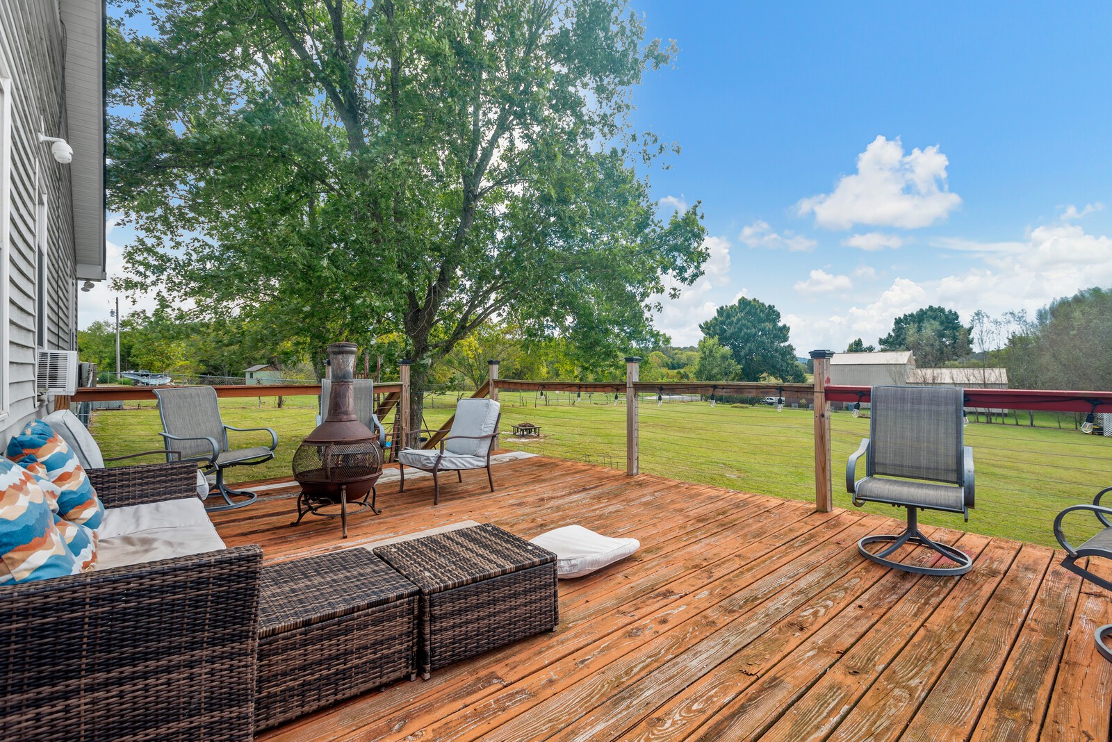 362 Norene Road Lebanon, TN 37090 - Photo 28 of 40 a roof deck with table and chairs a barbeque with wooden floor and fence