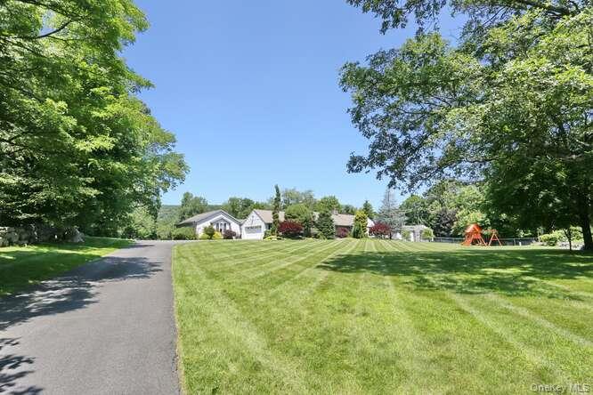 89 Spook Rock Road Suffern, NY 10901 - Photo 2 of 44 a big yard with lots of green space and trees
