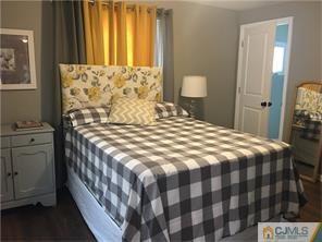 34 Colton Road Edison, NJ 08817 - Photo 3 of 5 a bedroom with a bed and a window