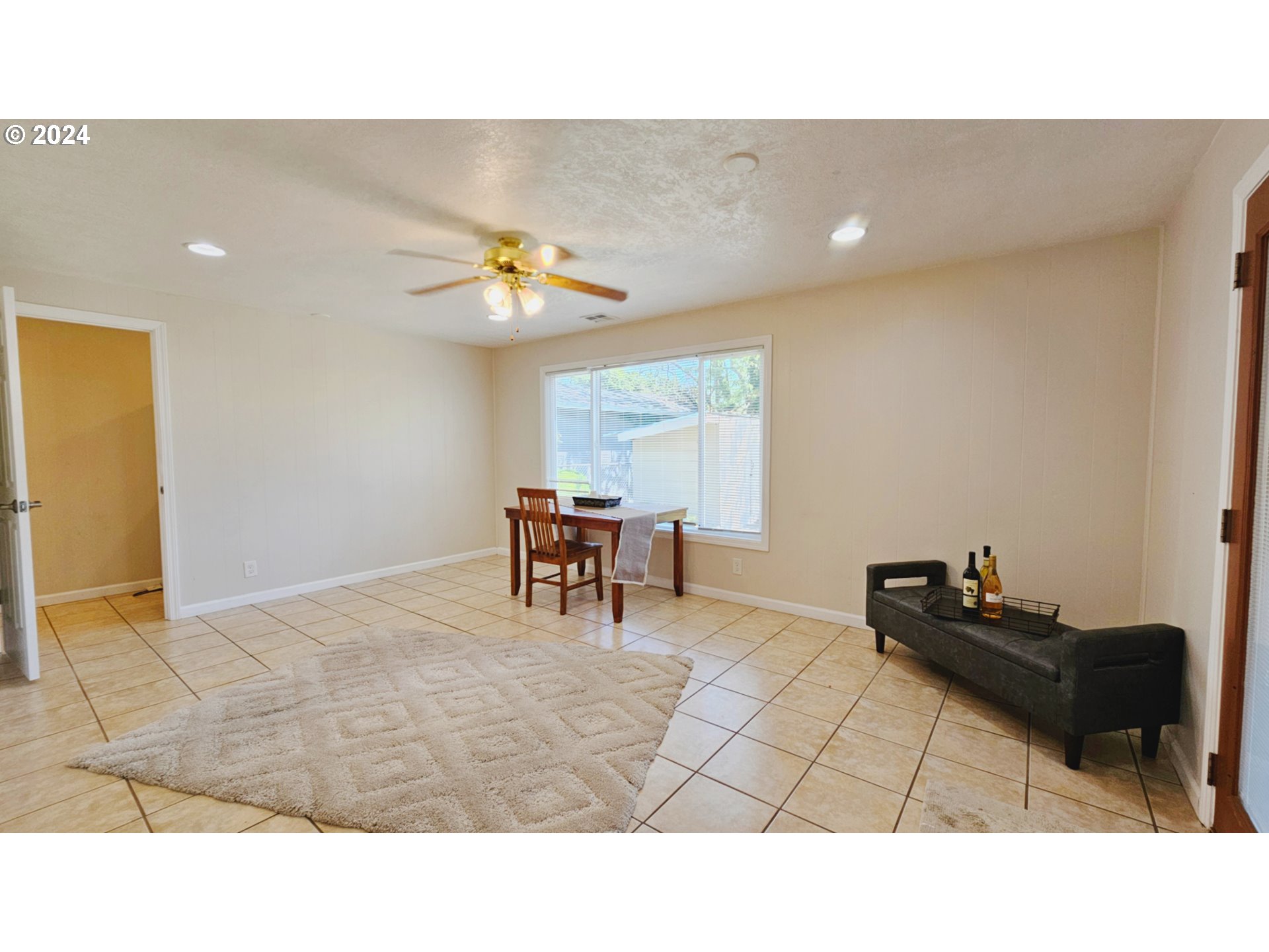 1151 Custom Way Springfield, OR 97477 - Photo 14 of 23 a living room with furniture and a dining table with projector