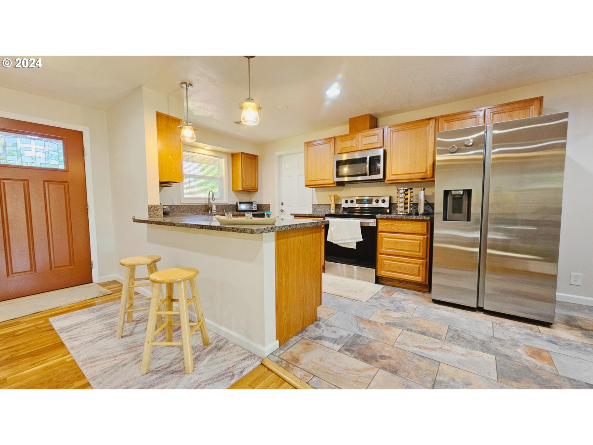 1151 Custom Way Springfield, OR 97477 - Photo 5 of 23 a kitchen with granite countertop a sink cabinets and stainless steel appliances