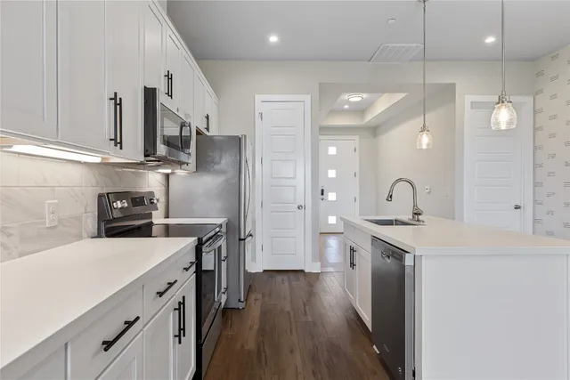 a view of a kitchen with washer and dryer