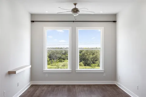 a kitchen with kitchen island a refrigerator and a stove top oven