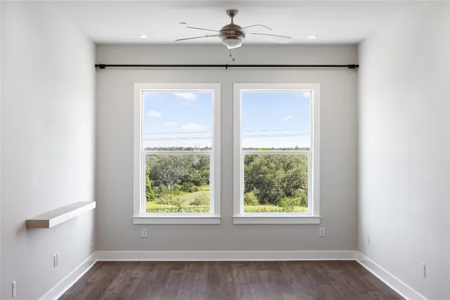 a kitchen with kitchen island a refrigerator and a stove top oven