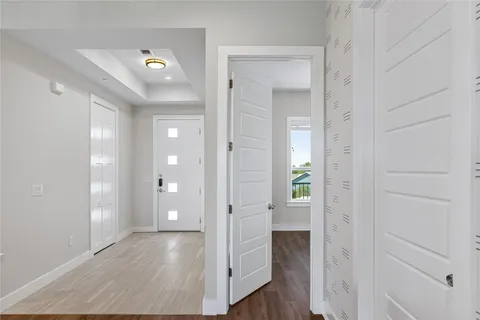 wooden floor in an empty room with a window