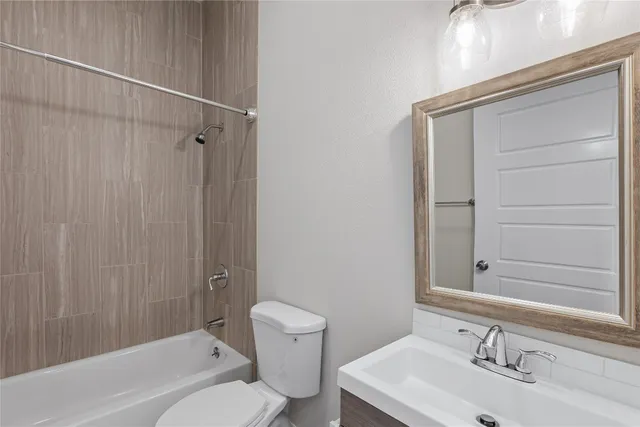 a view of walk in closet with wooden floor