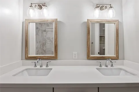 an empty room with wooden floor sink and closet