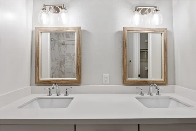an empty room with wooden floor sink and closet