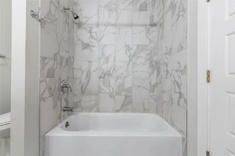 a bathroom with a double vanity sink mirror and