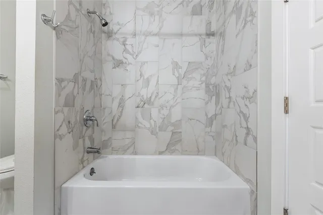 a bathroom with a double vanity sink mirror and