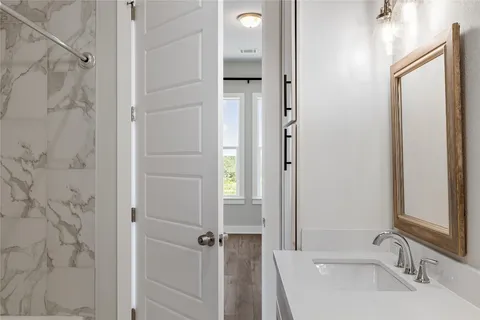 a bathroom with a sink and a mirror