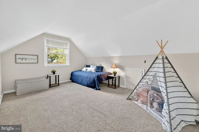 a view of empty room with a fireplace