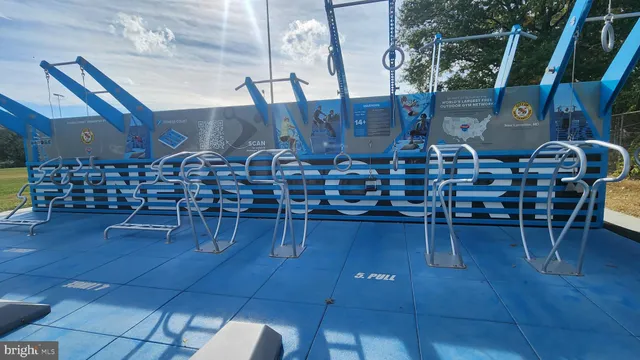 a view of a bench in middle of the green field