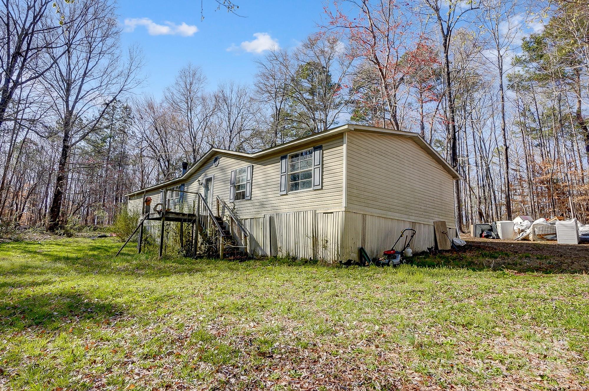 2166 Hough Road Lancaster, SC 29720 - Photo 16 of 23 a backyard of a house with lots of green space