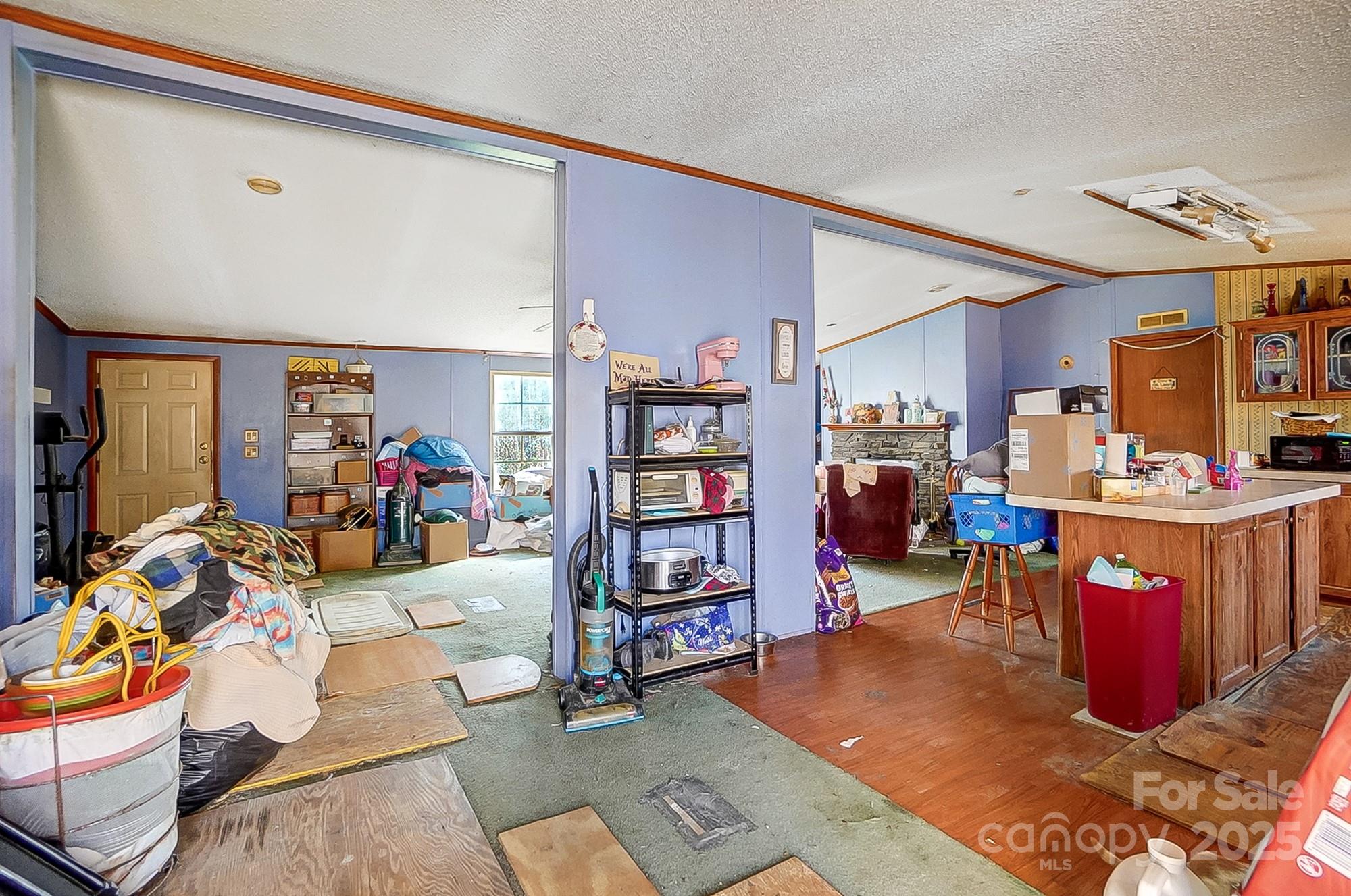 2166 Hough Road Lancaster, SC 29720 - Photo 17 of 23 a living room with lots of furniture and clutter
