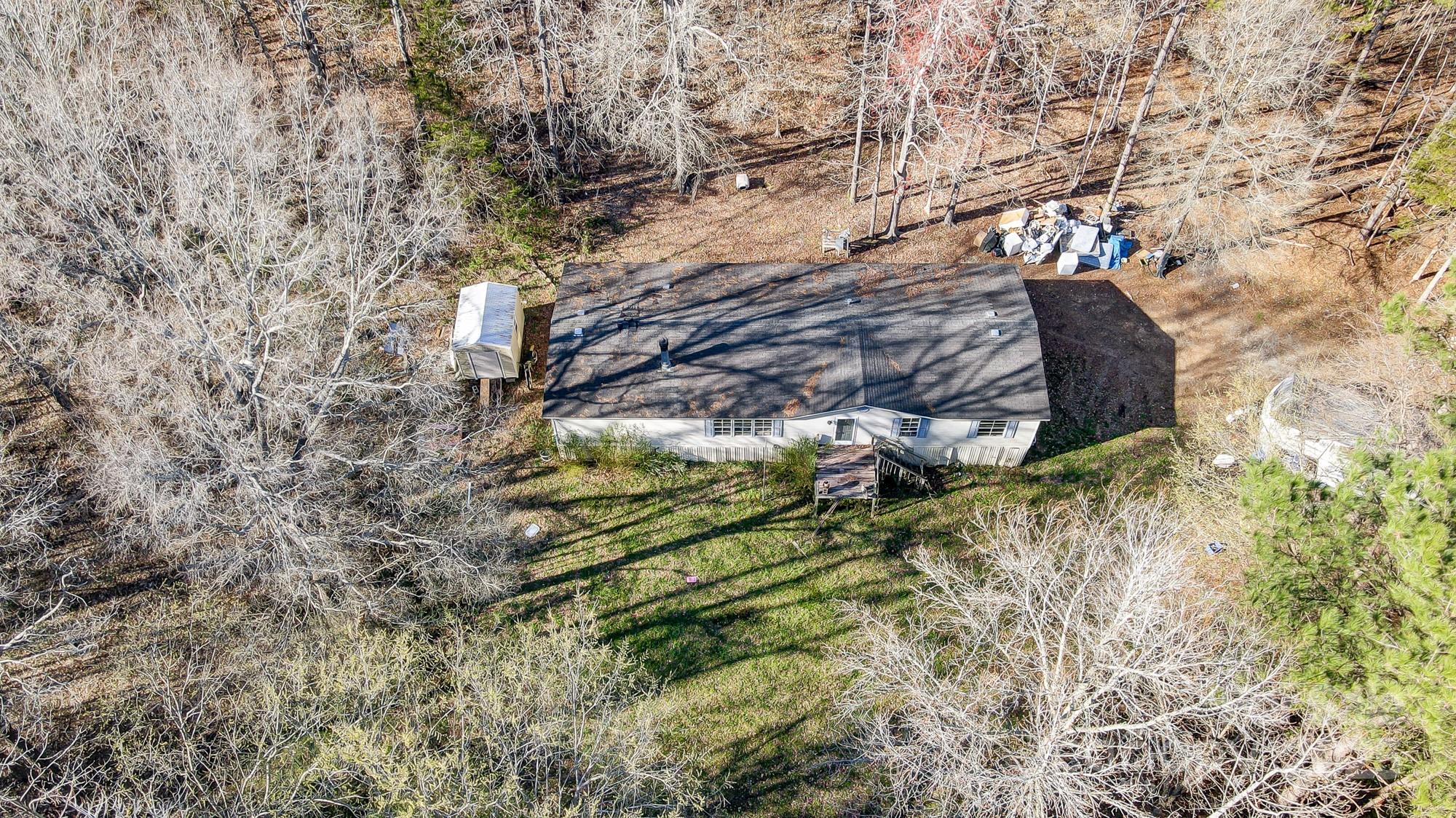 2166 Hough Road Lancaster, SC 29720 - Photo 5 of 23 a backyard of a building with large trees