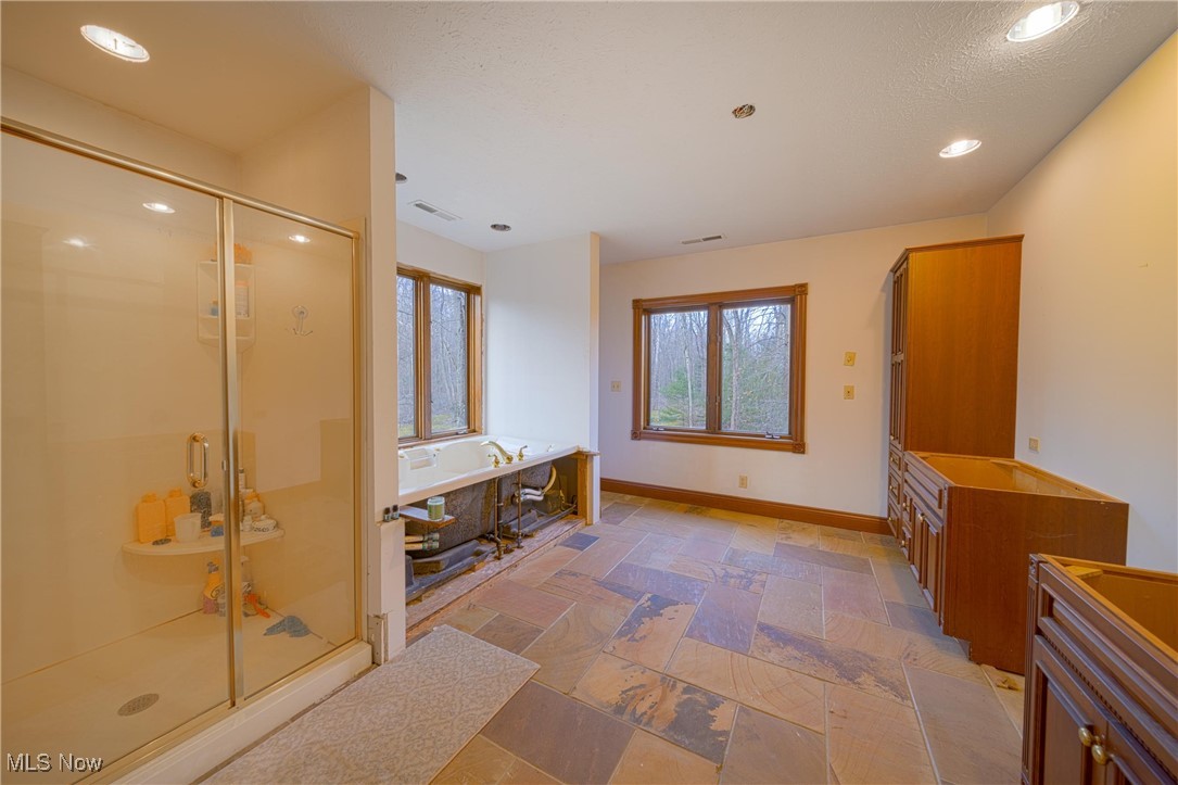 10000 Wisner Road Willoughby, OH 44094 - Photo 20 of 32 Bathroom featuring vanity, tile floors, and separate shower and tub