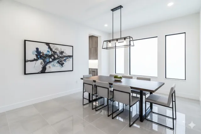 a kitchen with refrigerator cabinets and a sink