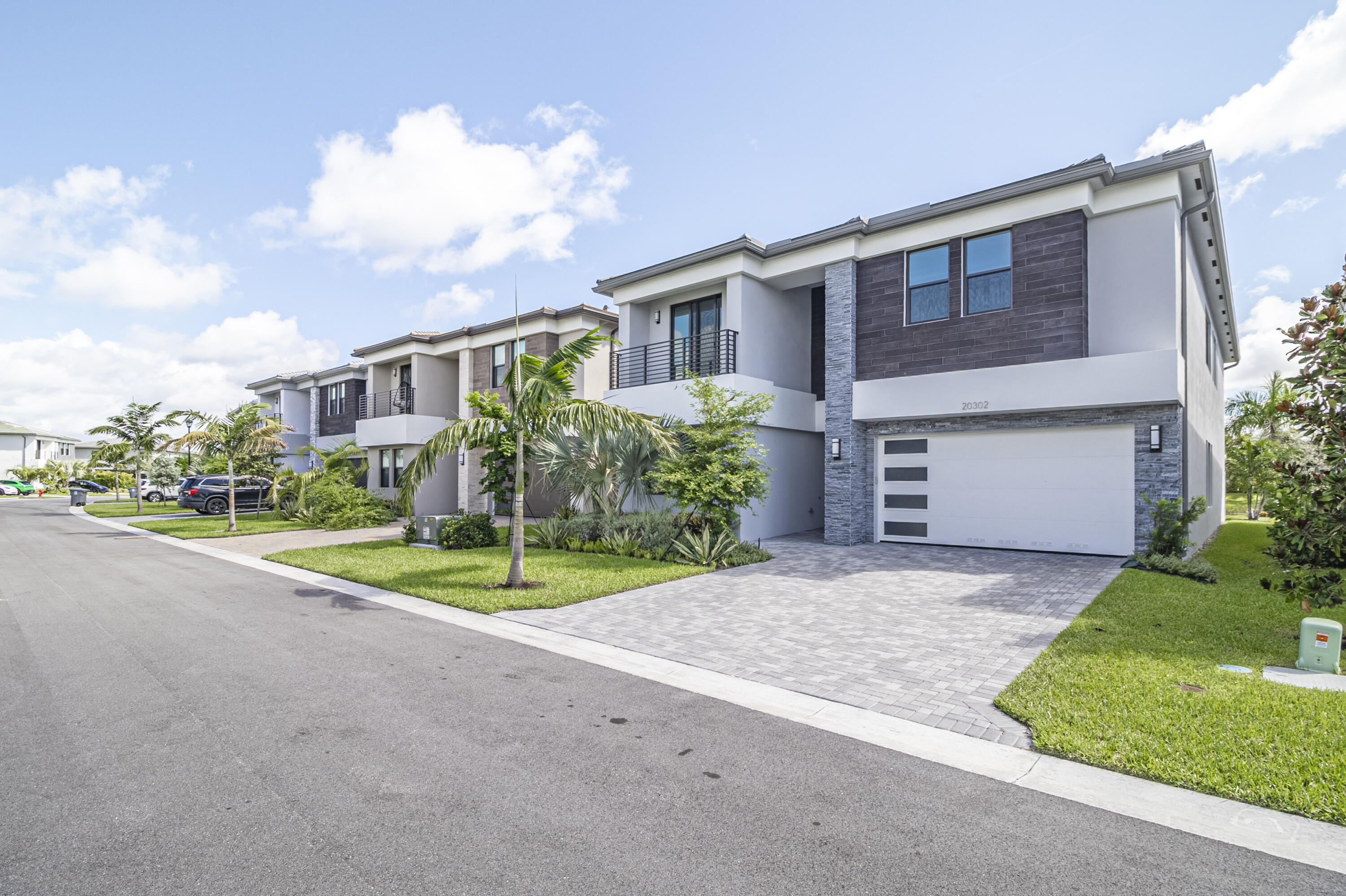 20302 Somerset Hls Drive Boca Raton, FL 33434 - Photo 2 of 111 a front view of house with yard and green space
