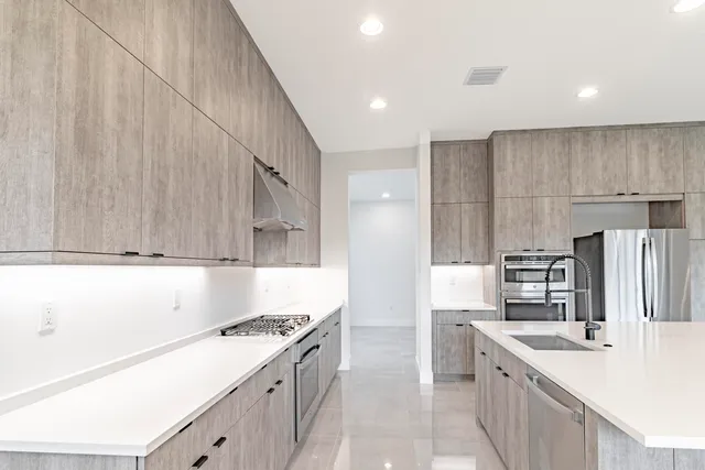 a spacious bedroom with a bed and a window