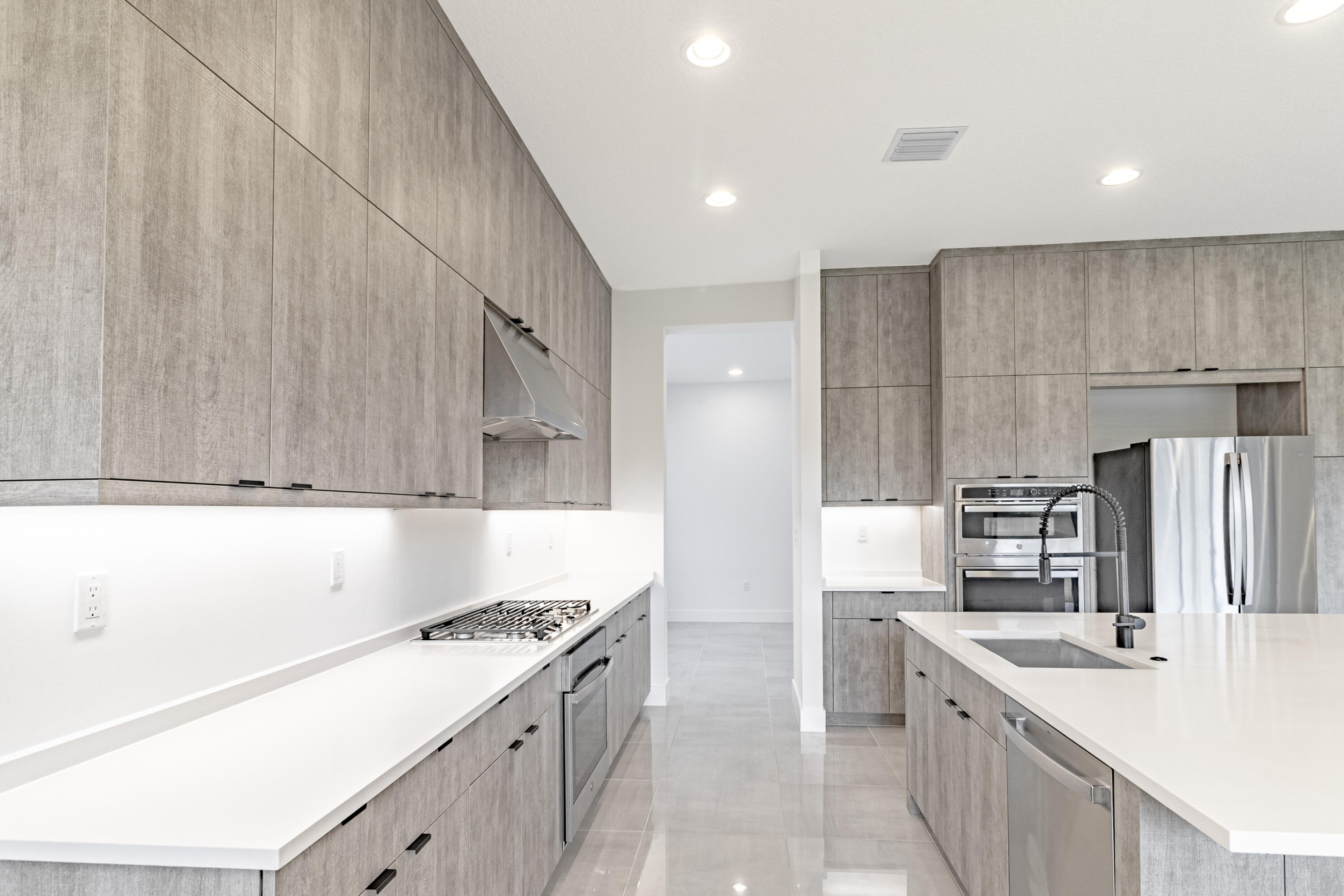 20302 Somerset Hls Drive Boca Raton, FL 33434 - Photo 21 of 111 a kitchen with refrigerator cabinets and a sink