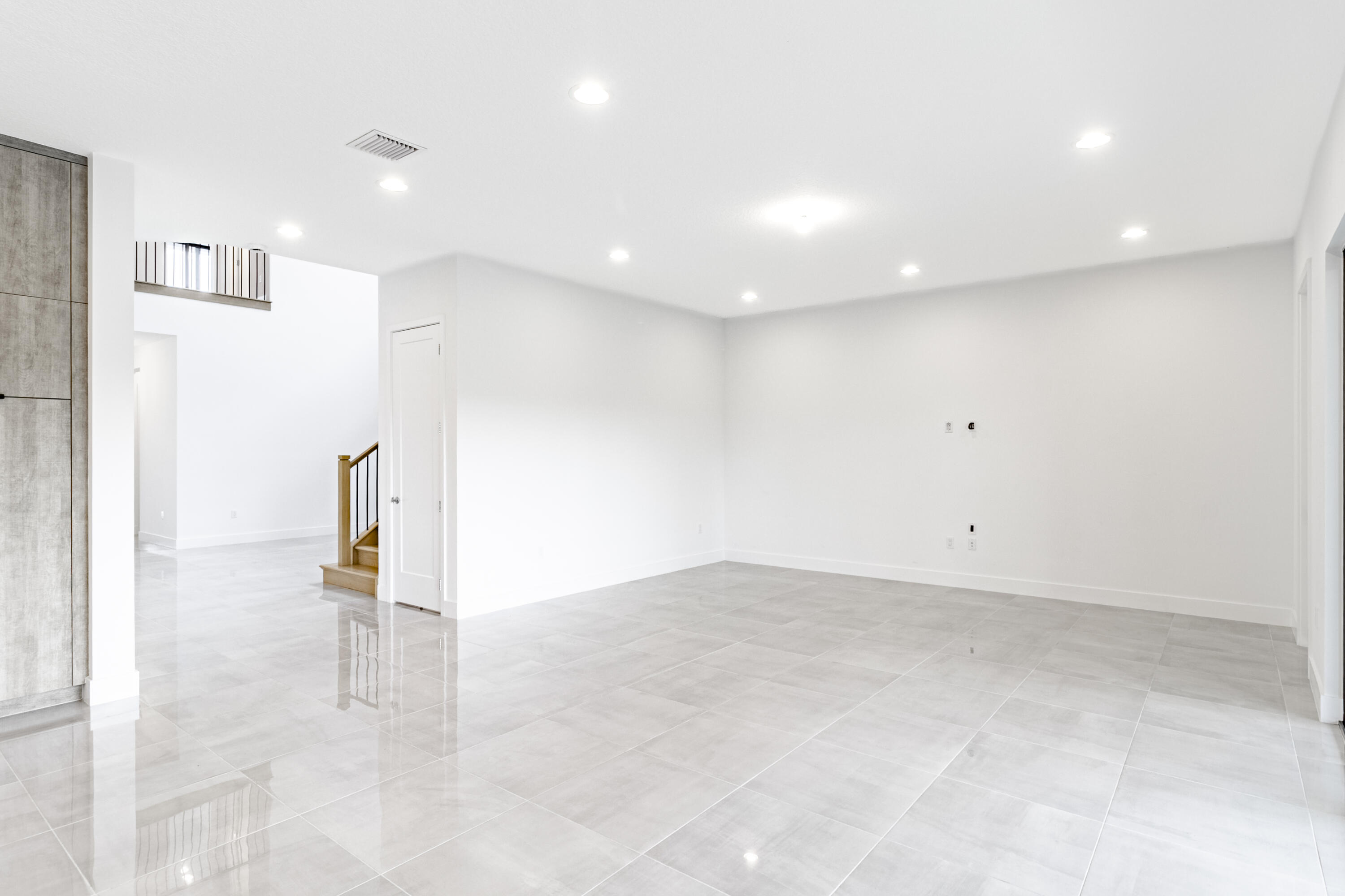 20302 Somerset Hls Drive Boca Raton, FL 33434 - Photo 22 of 111 an empty room with staircase and a view of bathroom