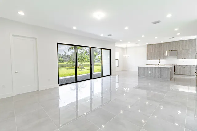 a bathroom with a granite countertop bathtub shower and toilet