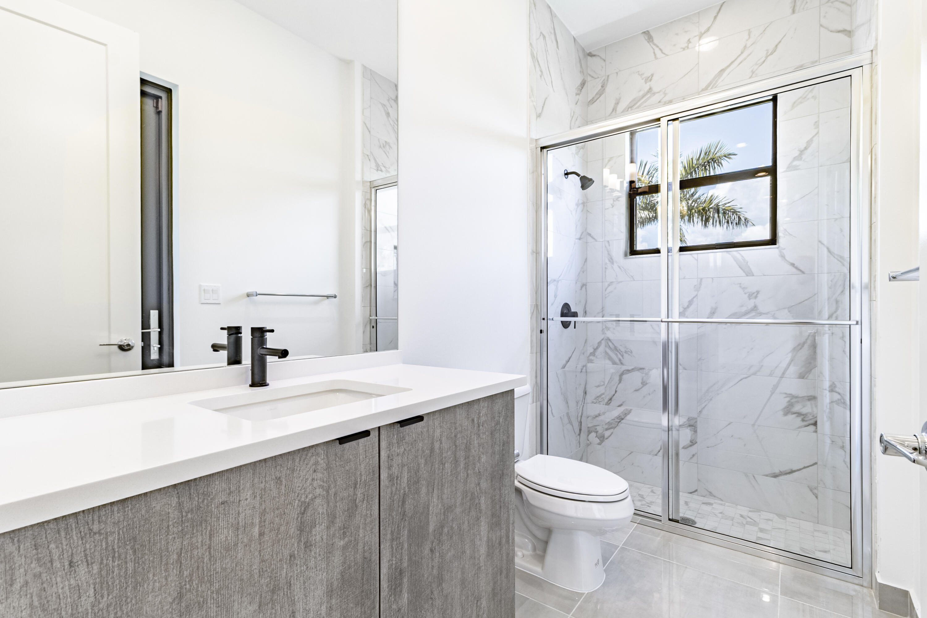 20302 Somerset Hls Drive Boca Raton, FL 33434 - Photo 26 of 111 a bathroom with a toilet a sink and a mirror