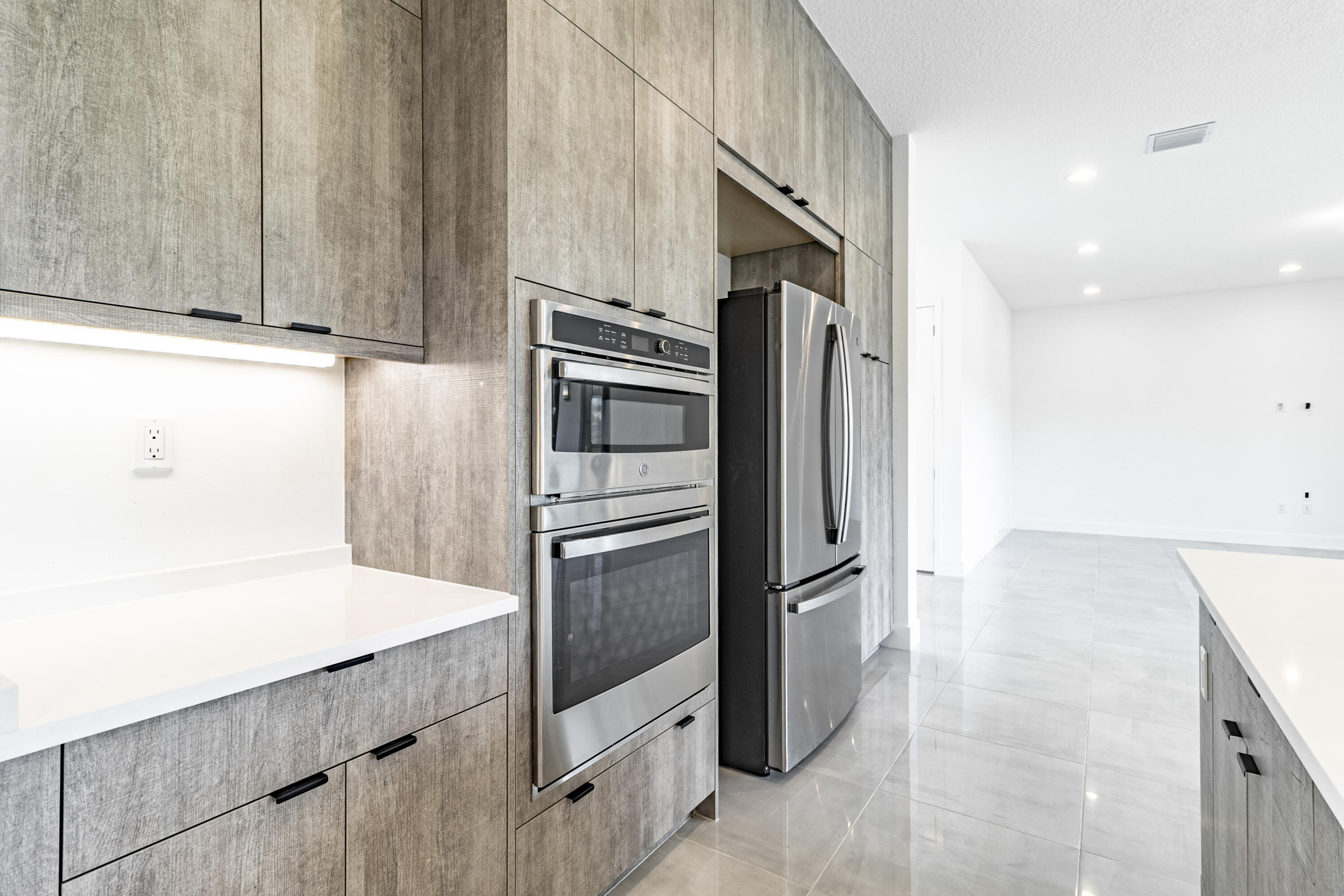 20302 Somerset Hls Drive Boca Raton, FL 33434 - Photo 27 of 111 a kitchen with stainless steel appliances a refrigerator and a stove