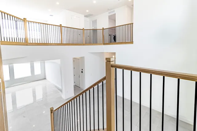 a bathroom with a granite countertop sink toilet and bathtub
