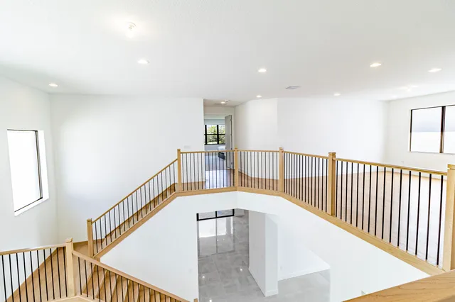 a view of a lake with a yard and a palm tree