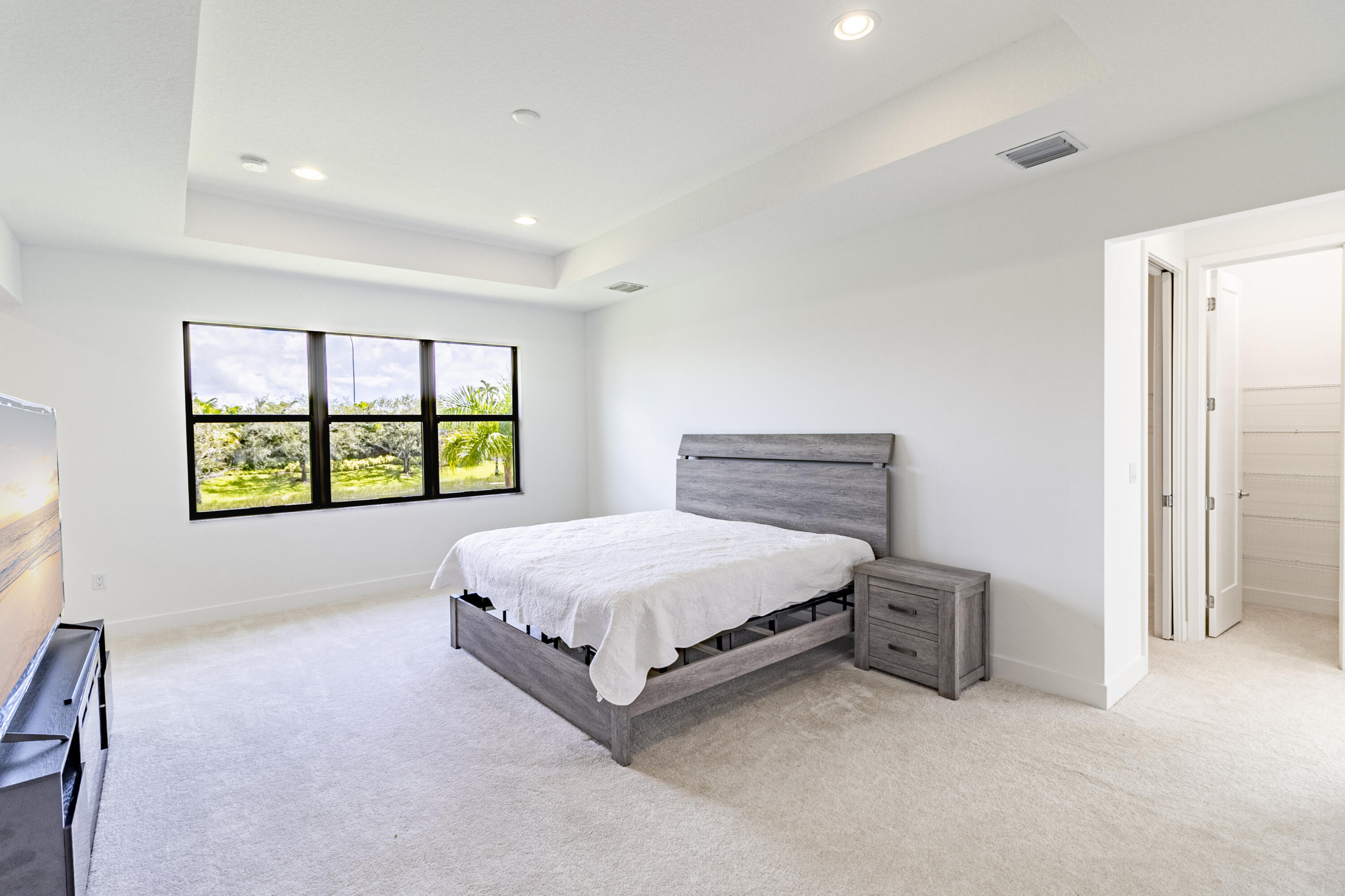 20302 Somerset Hls Drive Boca Raton, FL 33434 - Photo 32 of 111 a spacious bedroom with a bed and a window