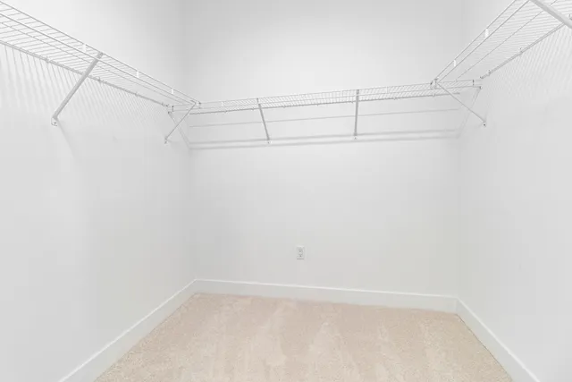 an aerial view of multiple houses with a yard