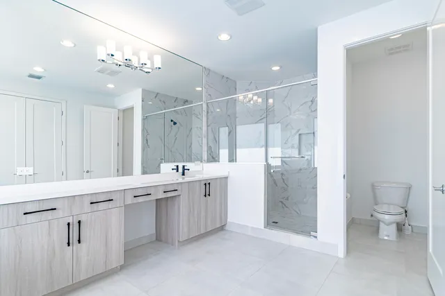 an aerial view of multiple houses with yard